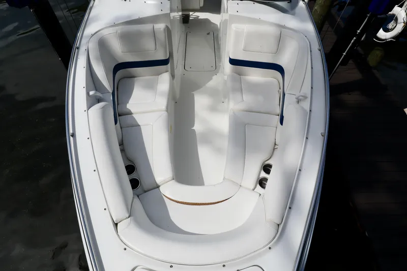 Slide: The Image of 2005 Formula 280 Bowrider boat with white seating area. - 2