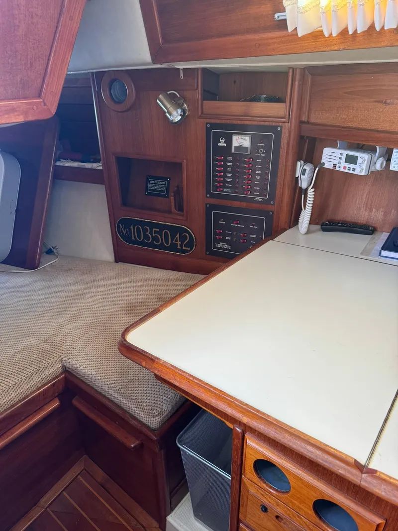 Slide: The Image of Interior of 1987 Ericson 35-3 sailboat with navigation equipment and wood finish. - 17