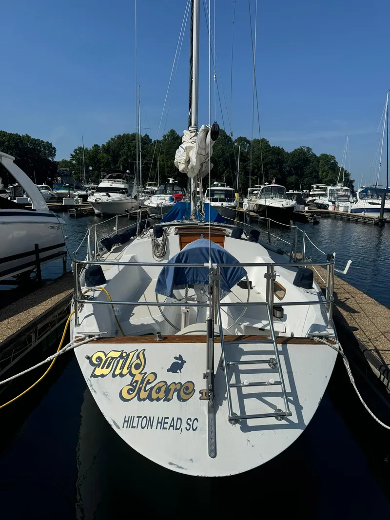 Slide: The Image of 1987 Ericson 35-3 sailboat "Wild Hare" docked at Hilton Head, SC marina. - 2