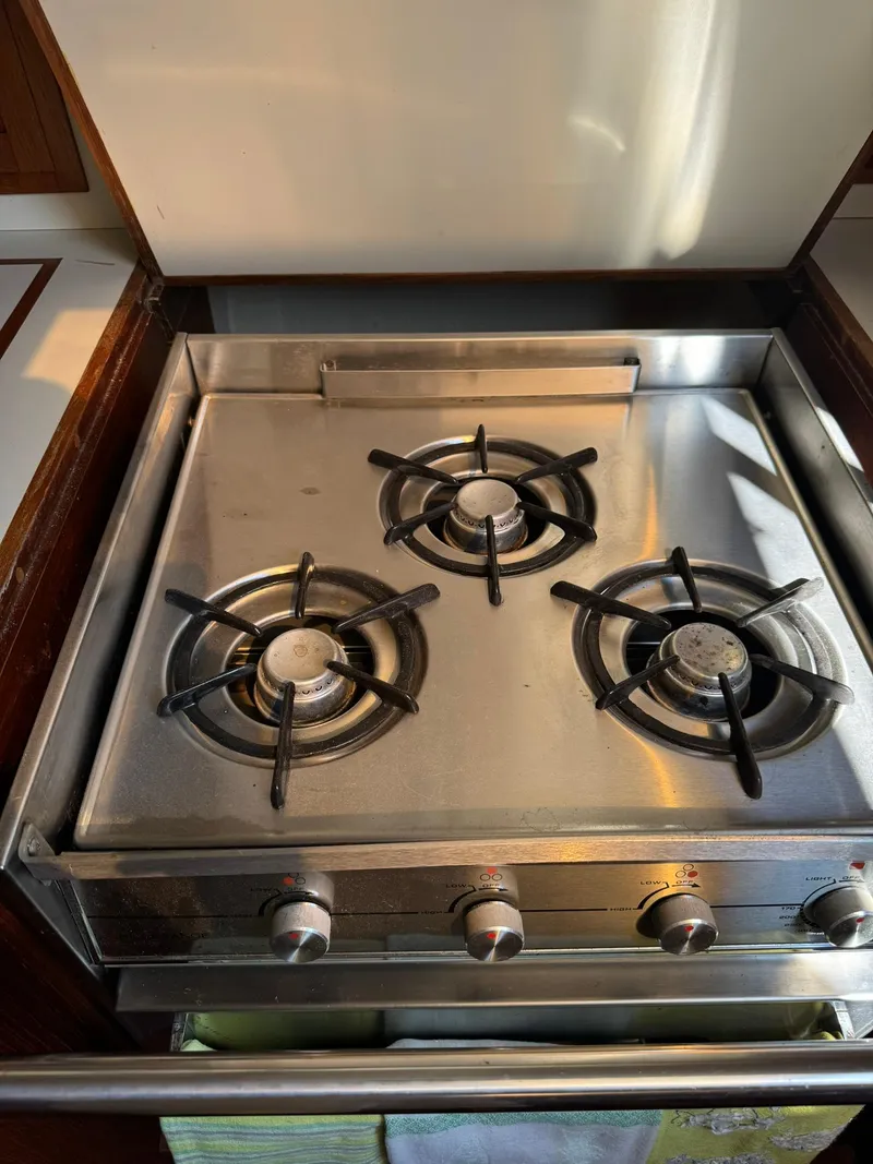 Slide: The Image of Stainless steel three-burner stove on 1987 Ericson 35-3 yacht. - 28