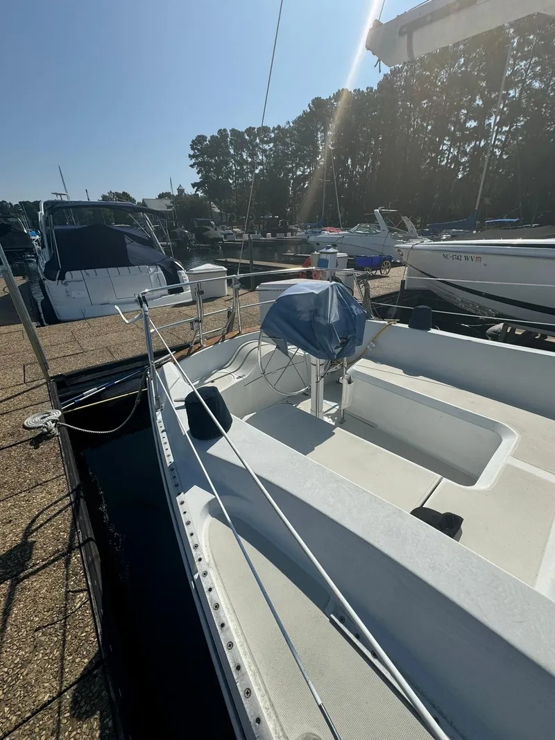 Slide: The Image of 1987 Ericson 35-3 sailboat docked in marina under clear sky. - 3
