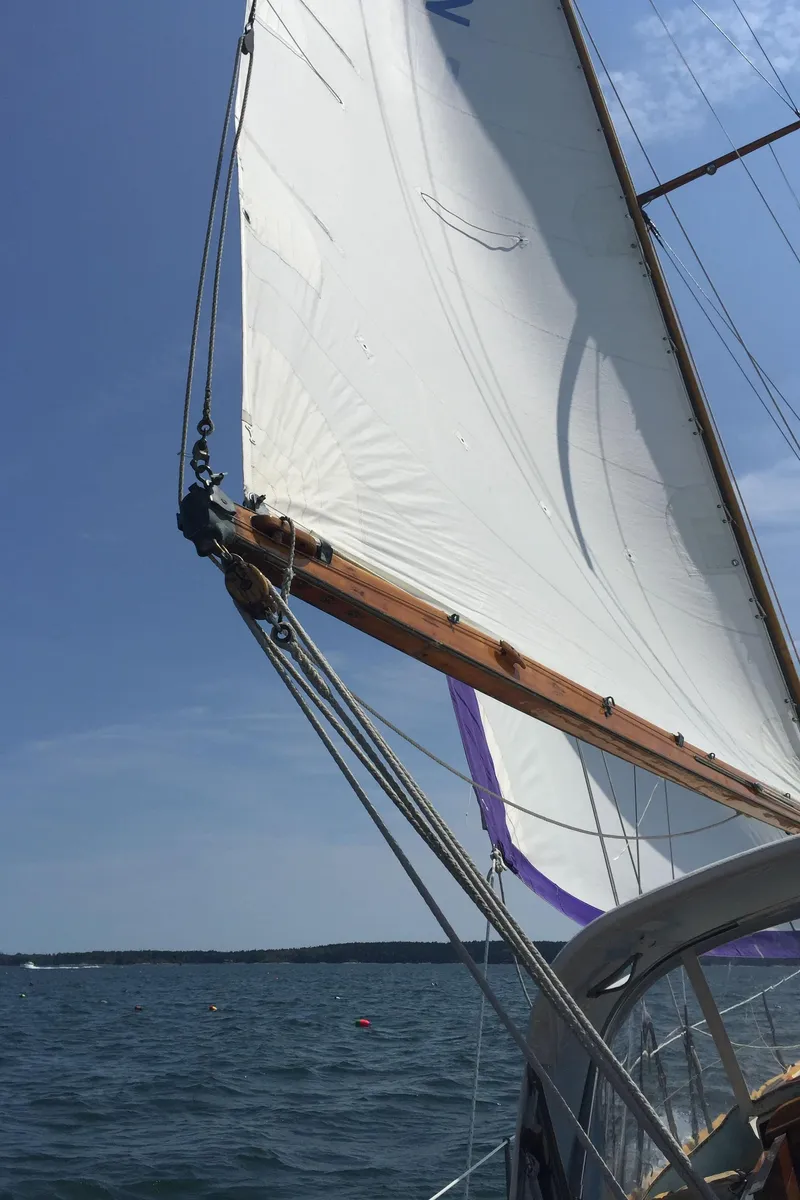 Slide: The Image of 1964 Concordia 41 Yawl sailing on open water under clear blue skies. - 25