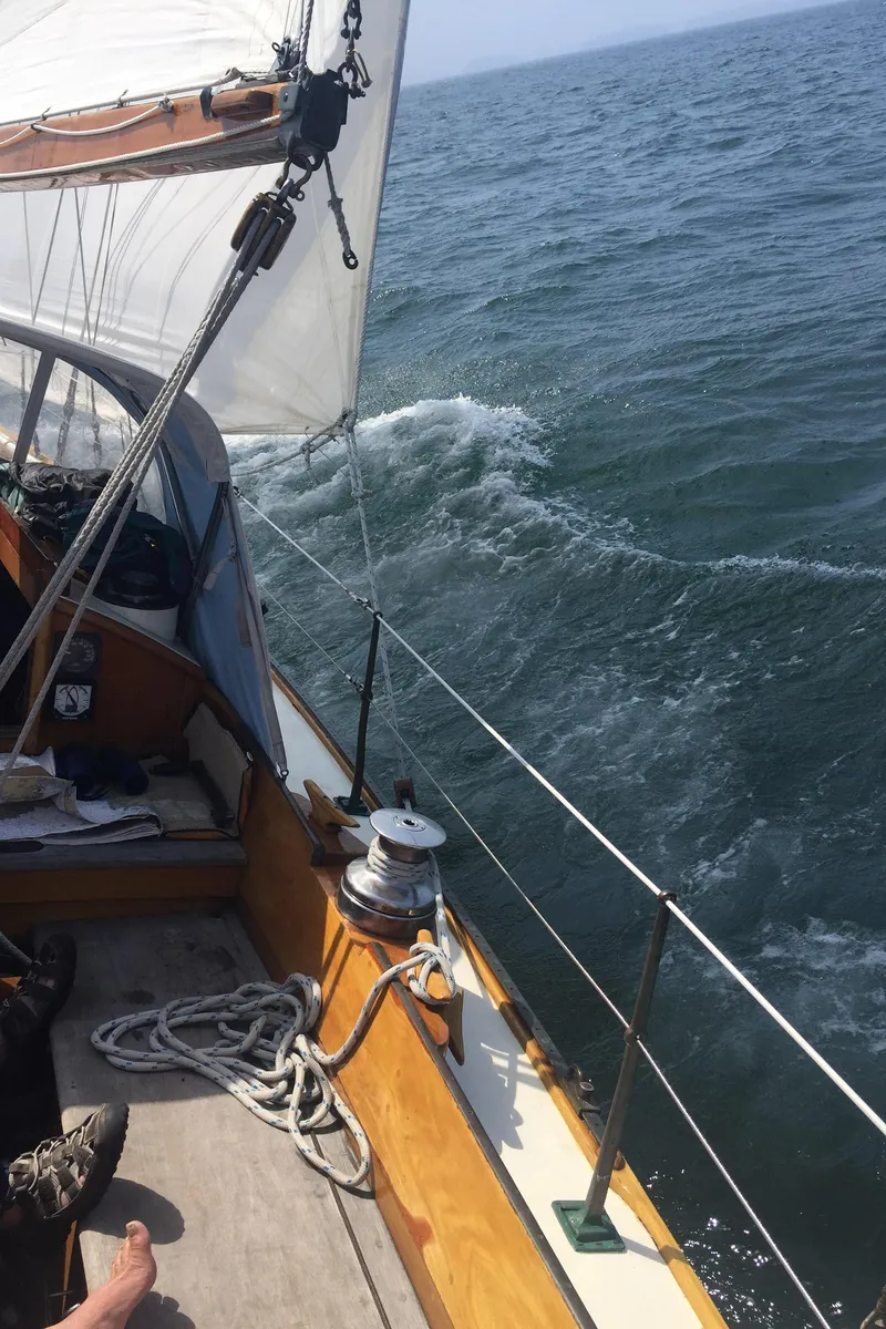 Slide: The Image of 1964 Concordia 41 Yawl sailing on open sea with visible deck and rigging. - 27