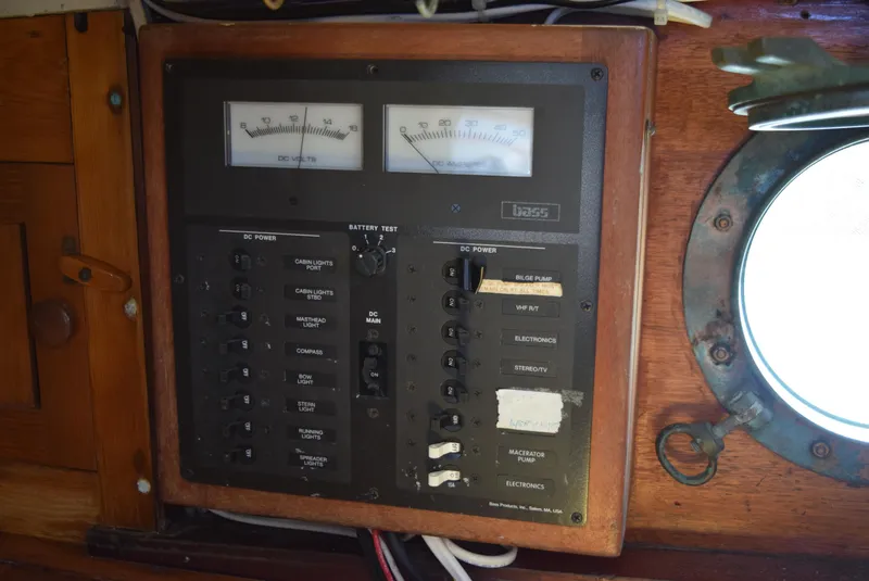 Slide: The Image of Electrical panel on a 1964 Concordia 41 Yawl, featuring gauges and switches. - 8