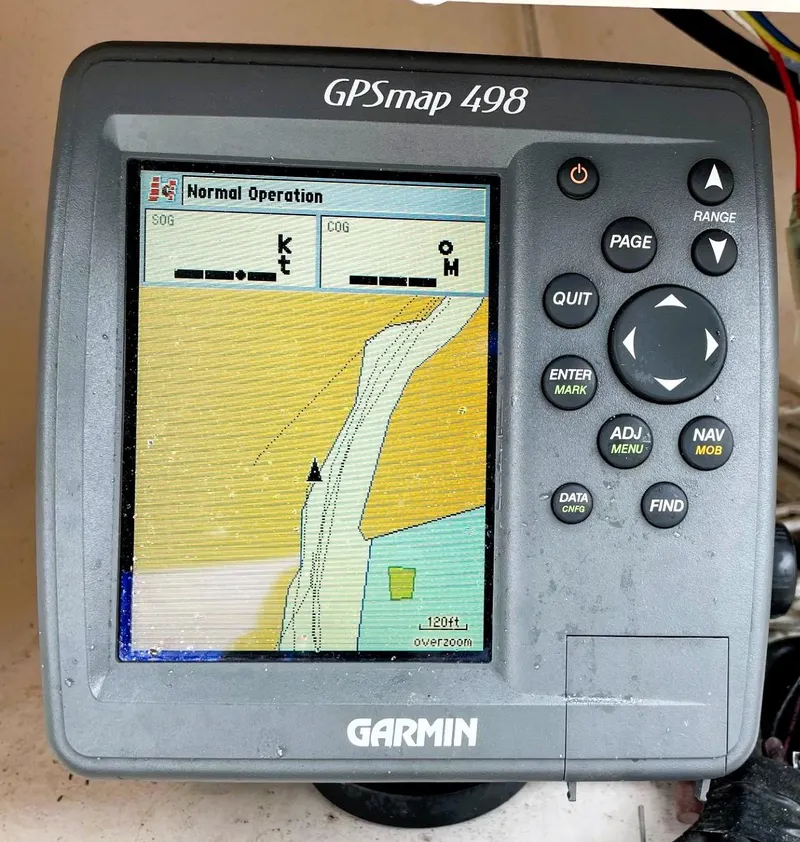Slide: The Image of Garmin GPSmap 498 on 2001 Grady-White Adventure 208 boat, displaying navigation map. - 13