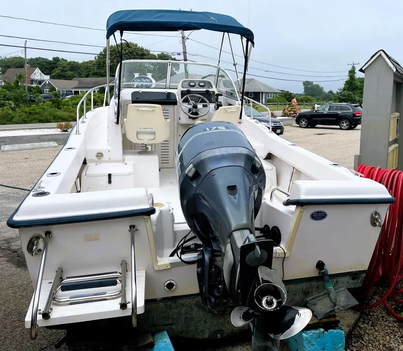 Slide: The Image of 2001 Grady-White Adventure 208 boat with outboard motor and canopy. - 3