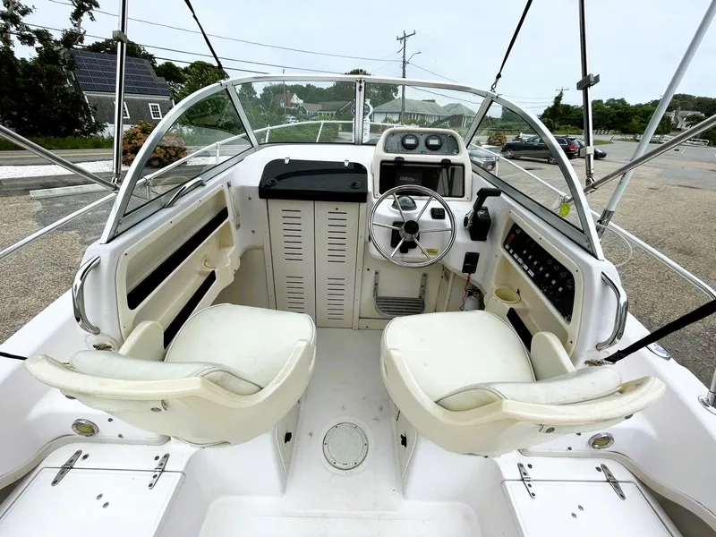 Slide: The Image of 2001 Grady-White Adventure 208 boat cockpit with dual seats and steering wheel. - 6