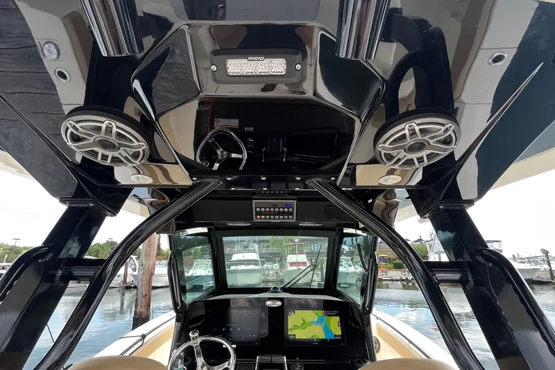 Slide: The Image of 2024 Scout 330 LXF boat interior with advanced navigation system and speakers. - 21