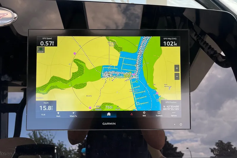 Slide: The Image of Garmin navigation display on 2024 Scout 330 LXF boat, showing map and speed data. - 32