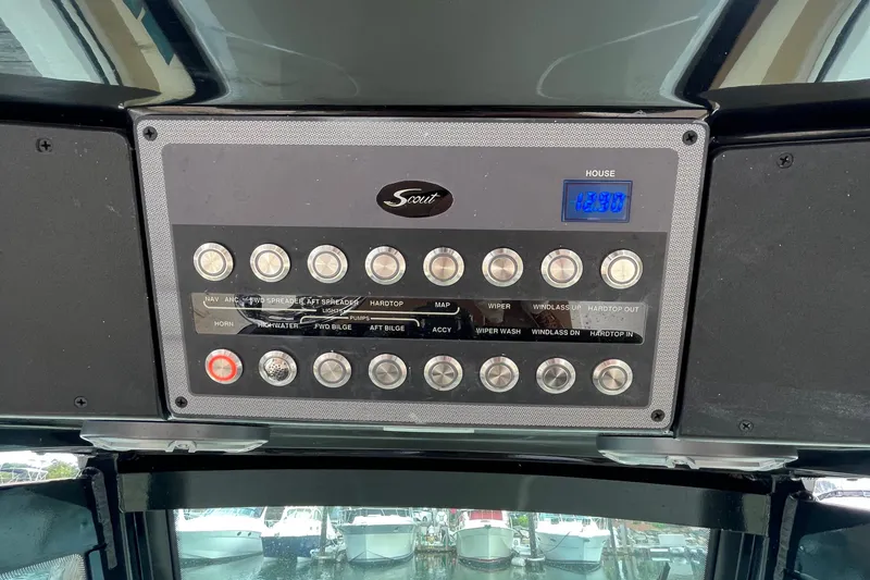 Slide: The Image of 2024 Scout 330 LXF control panel with switches and digital display. - 34