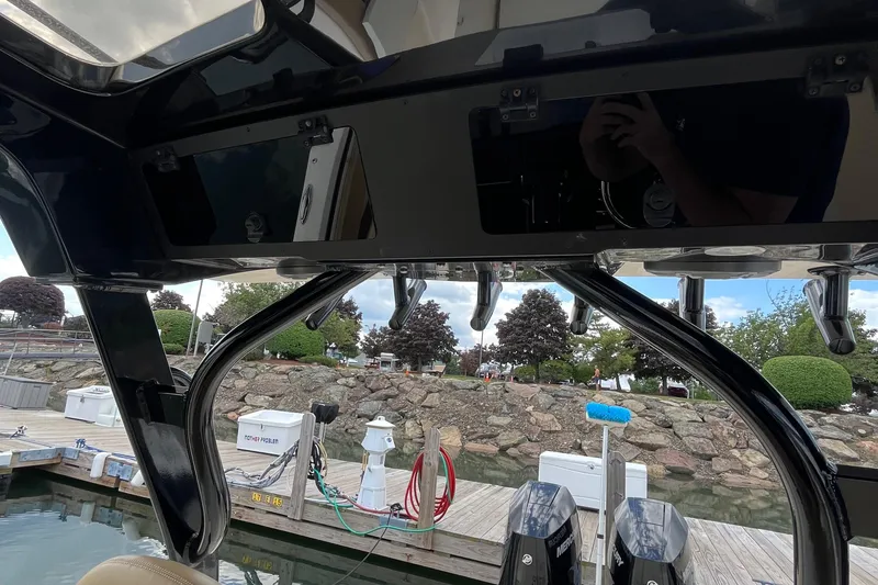 Slide: The Image of 2024 Scout 330 LXF boat interior with dock view and equipment. - 36