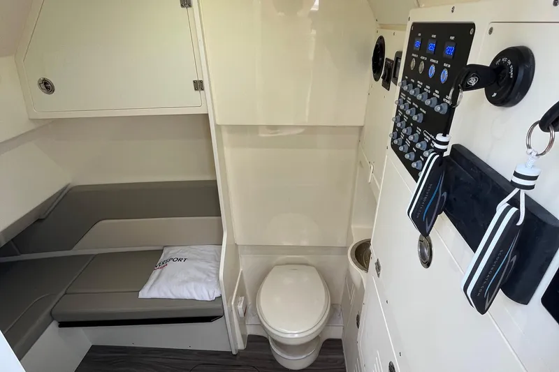 Slide: The Image of 2024 Scout 330 LXF cabin interior with toilet and control panel. - 41