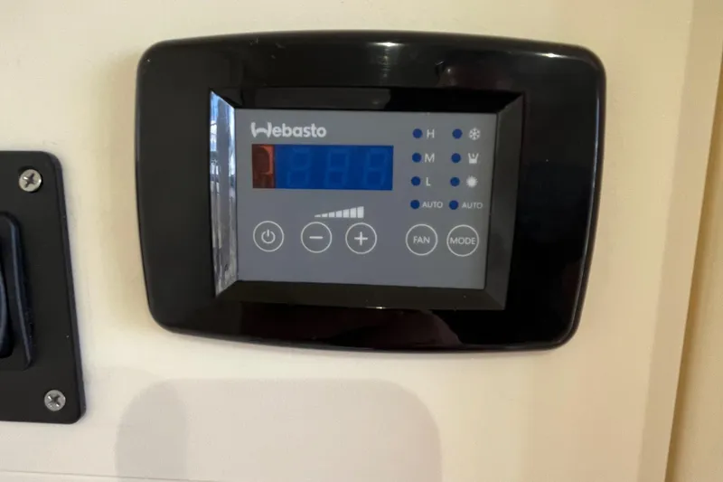 Slide: The Image of Webasto control panel on 2024 Scout 330 LXF boat interior. - 44