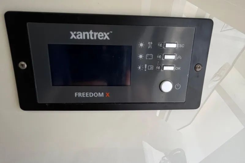 Slide: The Image of Xantrex Freedom X control panel on 2024 Scout 330 LXF boat. - 45