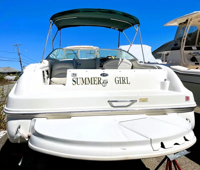 Slide: The Image of 2001 Sea Ray 225 Weekender boat named "Summer Girl" with green canopy. - 10