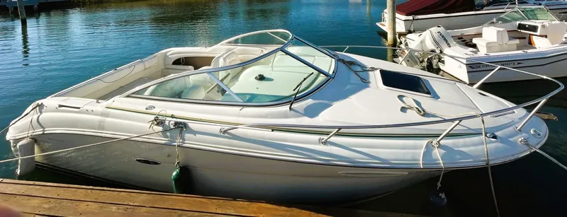 Slide: The Image of 2001 Sea Ray 225 Weekender boat docked in a marina. - 4