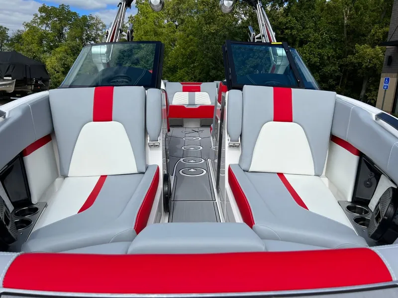 Slide: The Image of 2023 MasterCraft X24 boat interior with red and white seating, sleek design. - 7