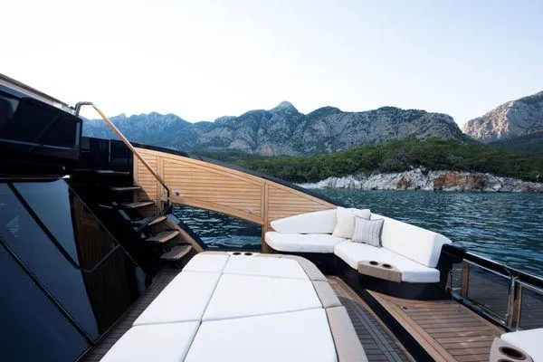 Slide: The Image of Luxurious 2023 Lazzara LSX 67 yacht deck with scenic mountain backdrop. - 12