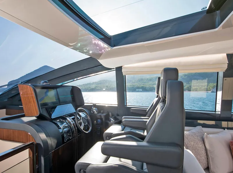 Slide: The Image of Luxurious interior of 2023 Lazzara LSX 67 yacht with modern helm and panoramic views. - 14