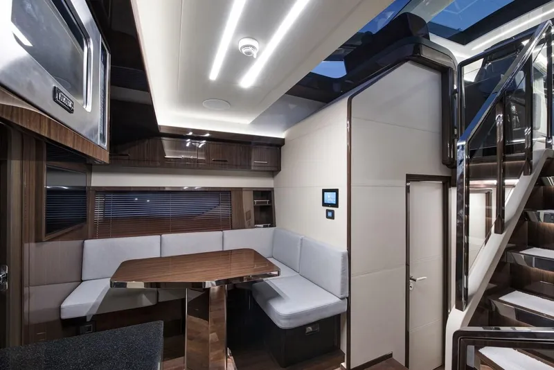 Slide: The Image of Luxurious interior of 2023 Lazzara LSX 67 yacht with modern seating and elegant design. - 17