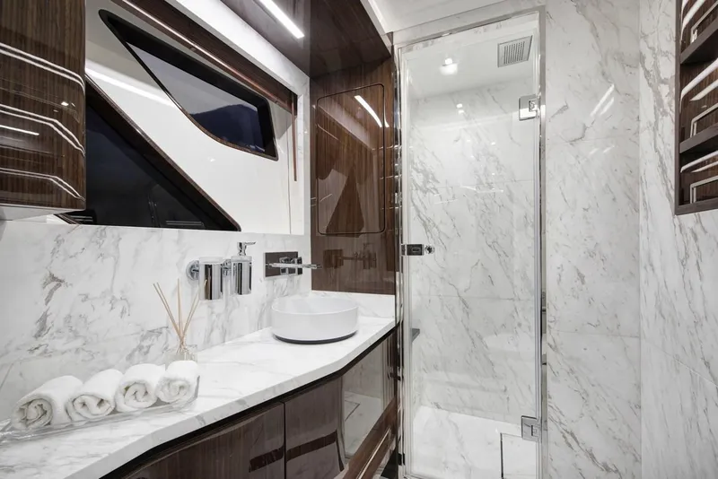 Slide: The Image of Luxurious 2023 Lazzara LSX 67 yacht bathroom with marble finishes and modern fixtures. - 21