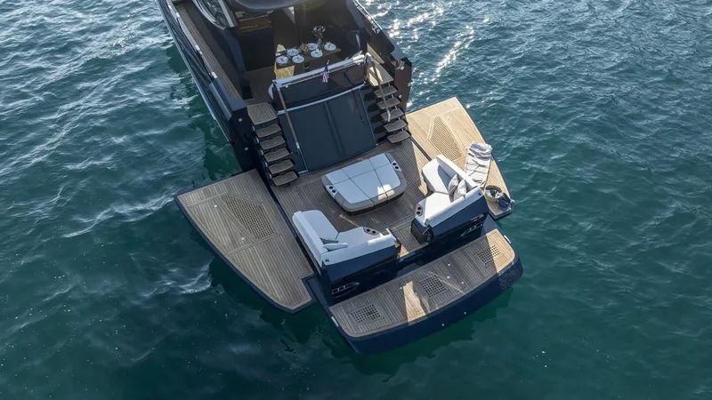 Slide: The Image of 2023 Lazzara LSX 67 yacht with spacious deck and luxurious seating on the water. - 8