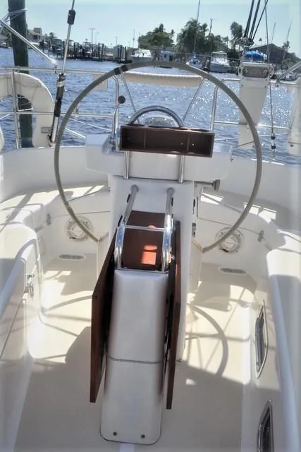Slide: The Image of Cockpit of 1998 Tartan 4100 sailboat with steering wheel and navigation equipment. - 27
