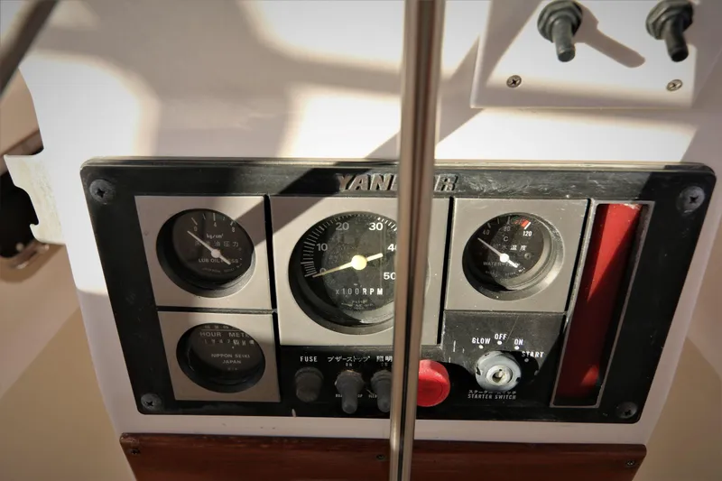 Slide: The Image of Control panel of a 1998 Tartan 4100 sailboat with gauges and switches. - 28