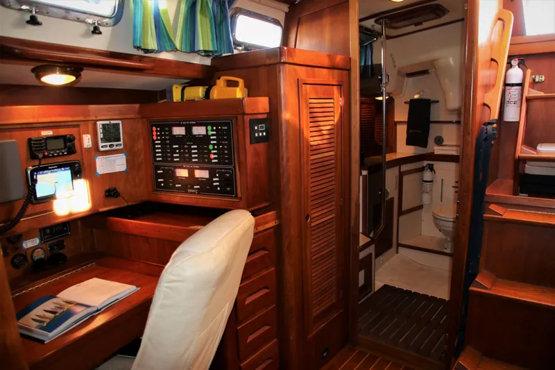 Slide: The Image of Interior of 1998 Tartan 4100 sailboat with navigation station and bathroom. - 30