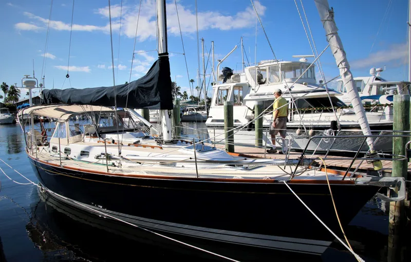 Slide: The Image of Sailboat docked at marina, Tartan 4100 model, 1998, with clear blue sky. - 6