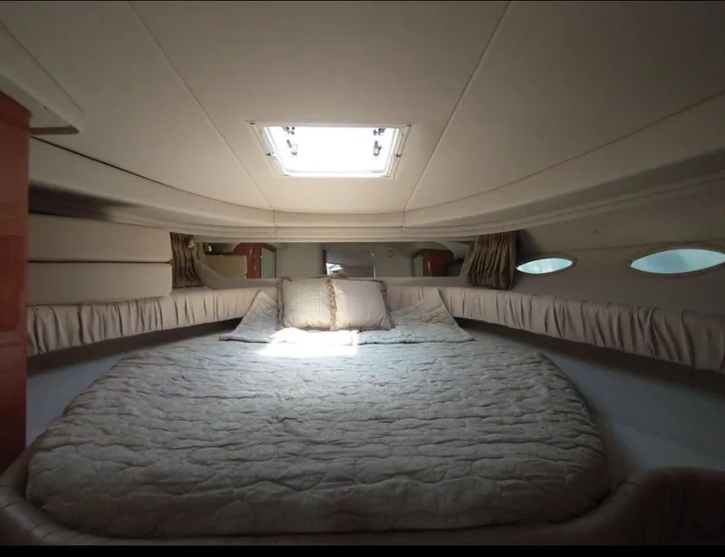 Slide: The Image of Interior cabin of 2001 Sea Ray 380 Sundancer with bed and skylight. - 4