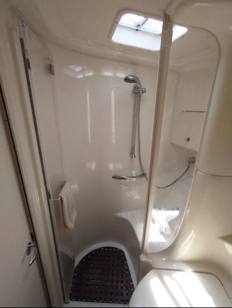 Slide: The Image of 2001 Sea Ray 380 Sundancer bathroom with shower and skylight. - 5