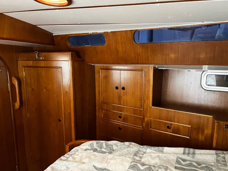 Slide: The Image of Cozy wooden cabin interior of 1987 Oyster 46.5 yacht with storage cabinets. - 24