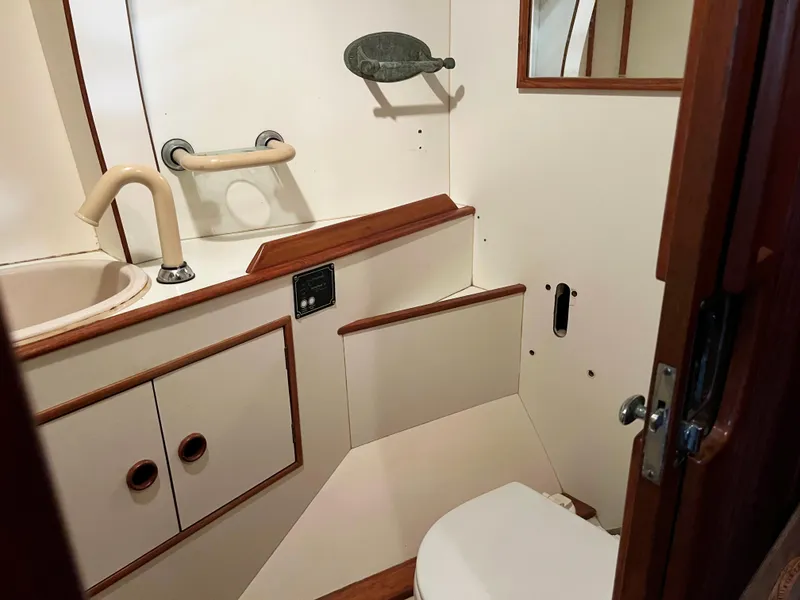 Slide: The Image of Interior of 1987 Oyster 46.5 yacht bathroom with sink and toilet. - 29