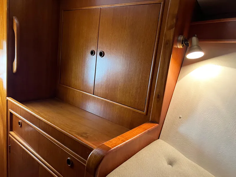 Slide: The Image of Wooden interior of 1987 Oyster 46.5 yacht with cabinet and ambient lighting. - 32