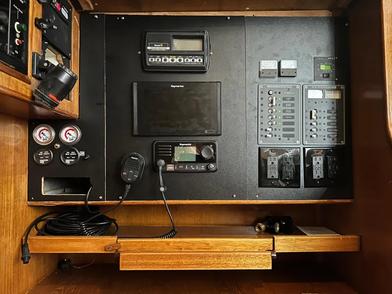 Slide: The Image of Control panel of a 1987 Oyster 46.5 yacht with navigation and communication equipment. - 9