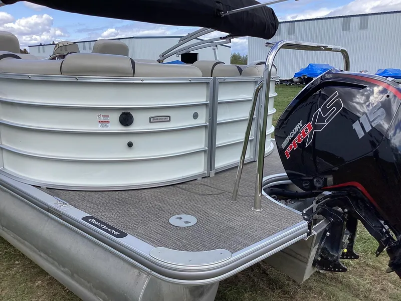 Slide: The Image of 2018 Berkshire 23RFX STS 2.0 pontoon boat with Mercury Pro XS engine, docked outdoors. - 6