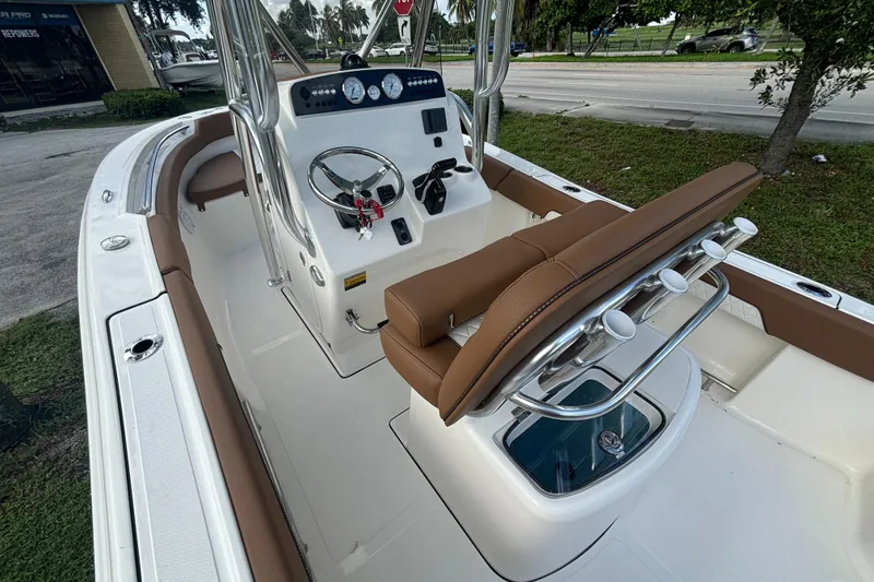 Slide: The Image of 2025 Pioneer 202 Sportfish boat interior with steering console and seating. - 15