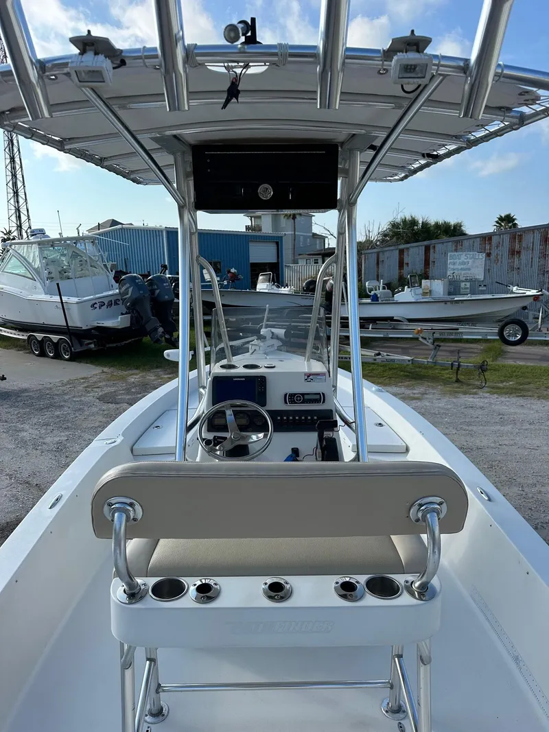 Slide: The Image of 2010 Pathfinder 2200-V boat with T-top and console, docked in a marina. - 4