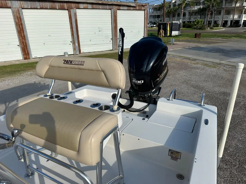 Slide: The Image of 2010 Pathfinder 2200-V boat with Yamaha 200 engine, beige seating, and rod holders. - 5