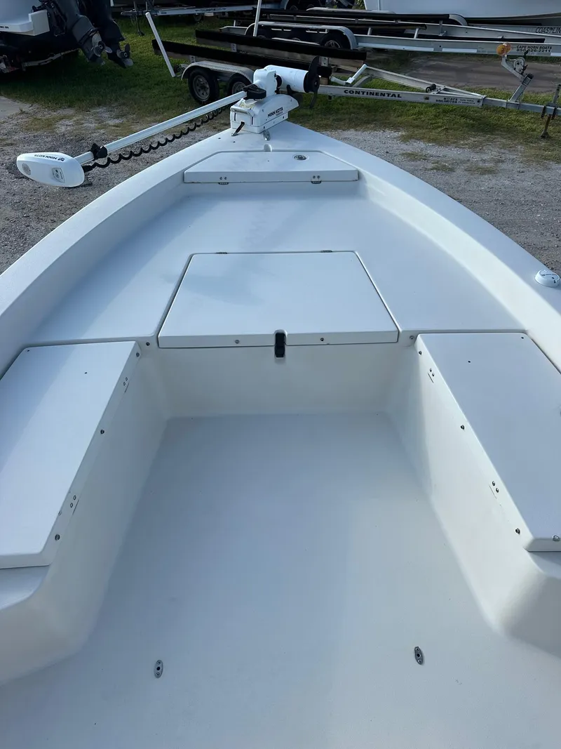 Slide: The Image of 2010 Pathfinder 2200-V boat interior with storage compartments and trolling motor. - 7