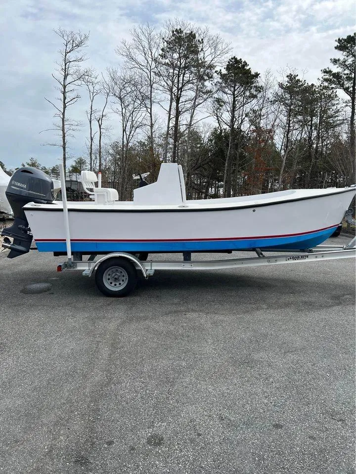 Slide: The Image of 2020 ROS Boats 20 Center Console on trailer, parked outdoors. - 1