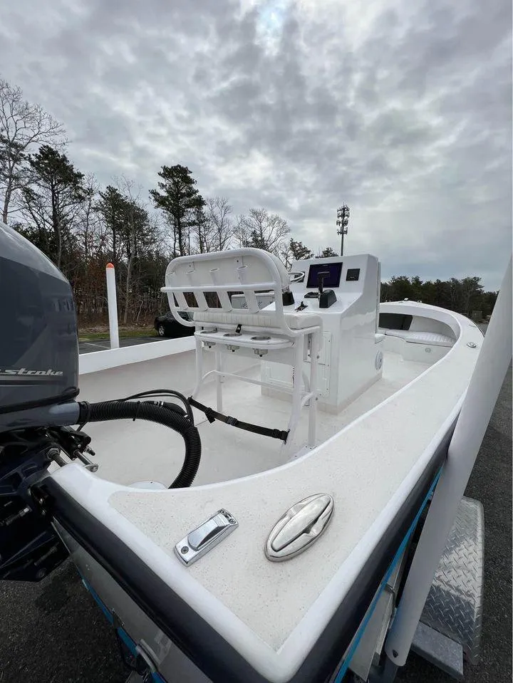 Slide: The Image of 2020 ROS Boats 20 Center Console on a cloudy day, featuring a sleek design and modern controls. - 6