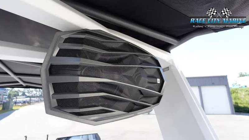 Slide: The Image of 2025 Nautique Super Air Nautique G23 boat speaker detail, Race City Marine branding. - 16
