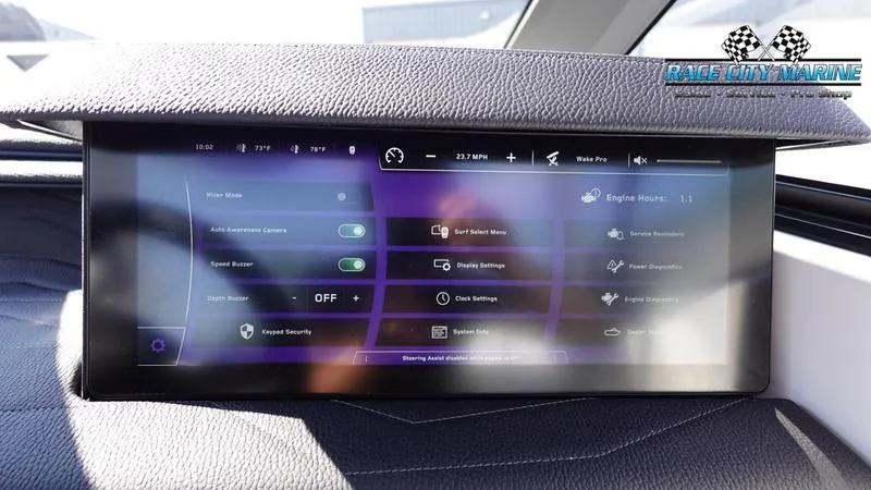Slide: The Image of 2025 Nautique Super Air Nautique G23 touchscreen display with various control settings. - 17