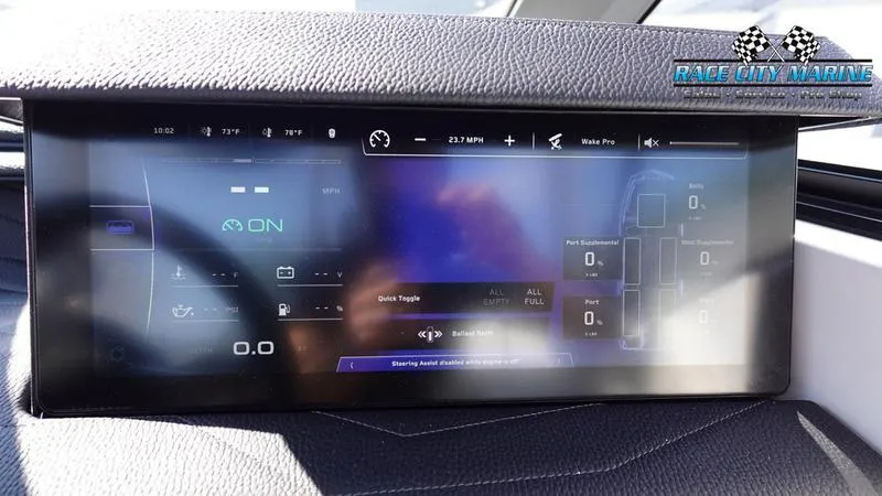 Slide: The Image of 2025 Nautique Super Air Nautique G23 dashboard display with digital controls and navigation. - 18