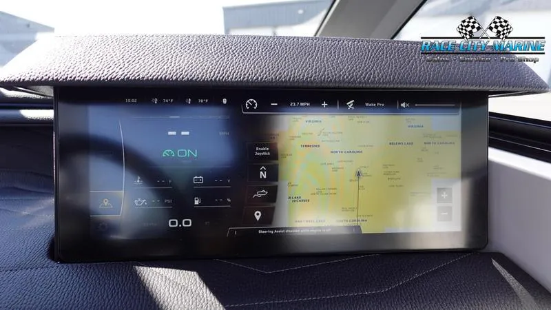 Slide: The Image of 2025 Nautique Super Air Nautique G23 dashboard display with navigation and controls. - 19