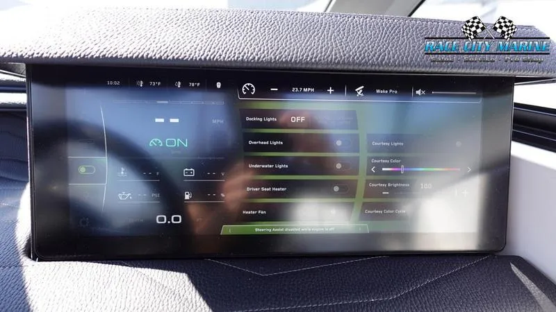 Slide: The Image of 2025 Nautique Super Air Nautique G23 dashboard display with control settings. - 20