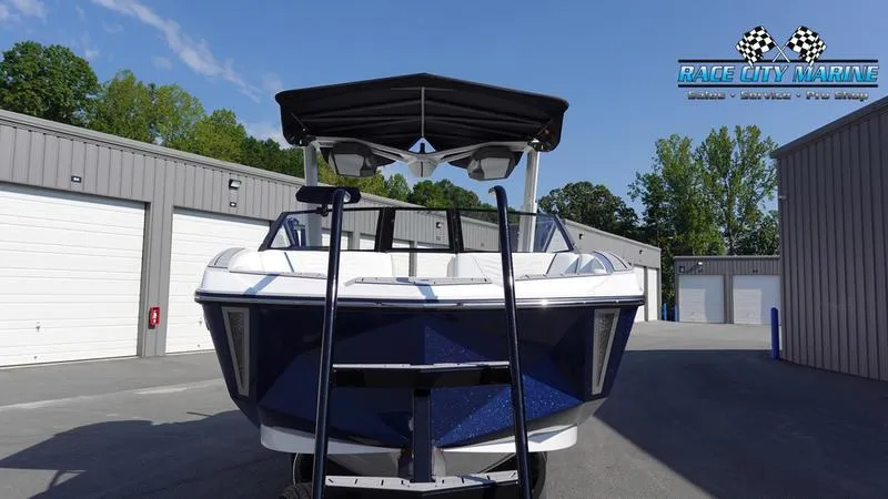 Slide: The Image of 2025 Nautique Super Air Nautique G23 boat in storage facility, front view. - 3