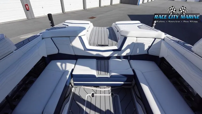 Slide: The Image of 2025 Nautique Super Air Nautique G23 boat interior with spacious seating. - 32